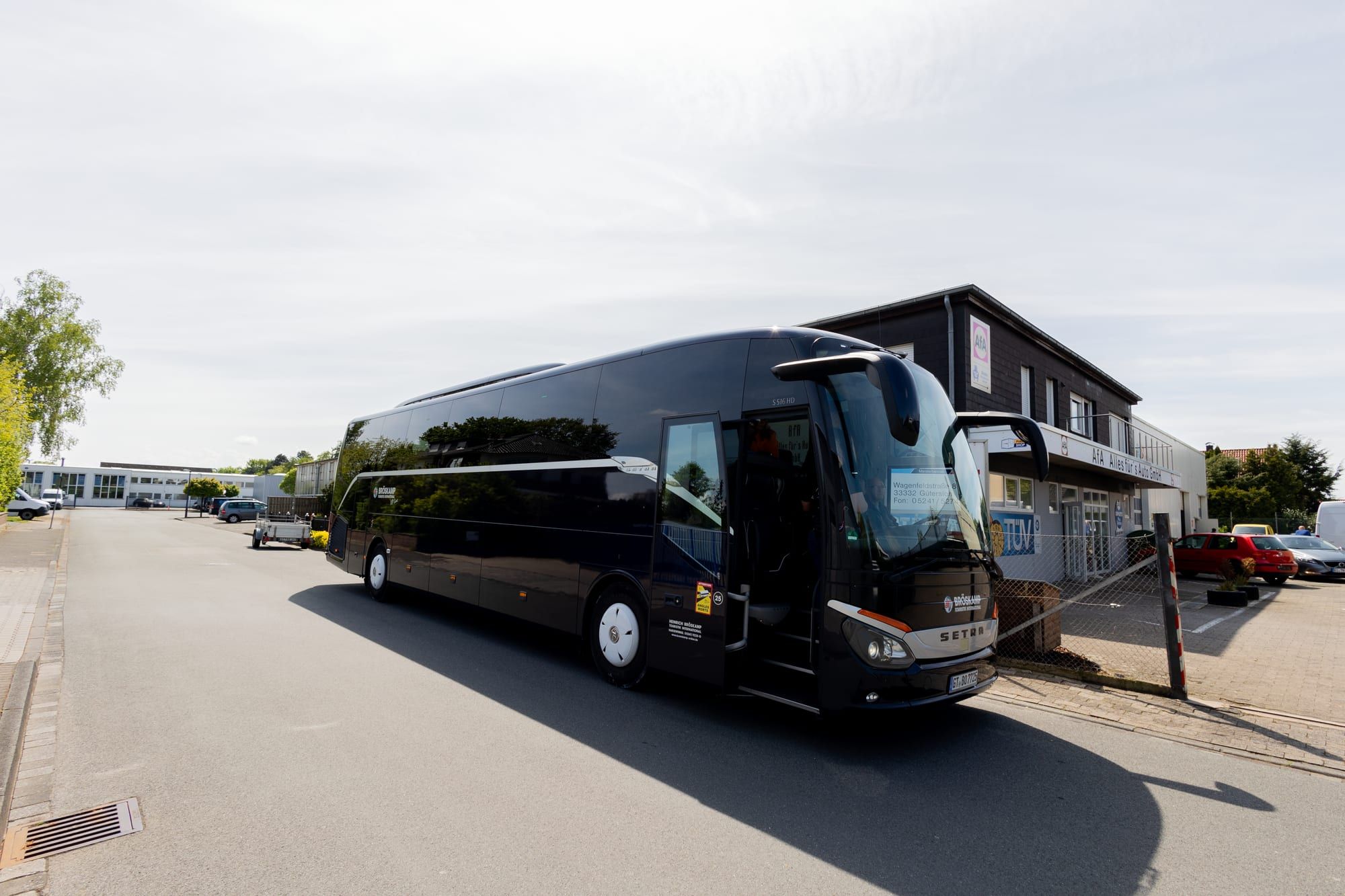 The coach in front of the office building, shortly before leaving for the celebration